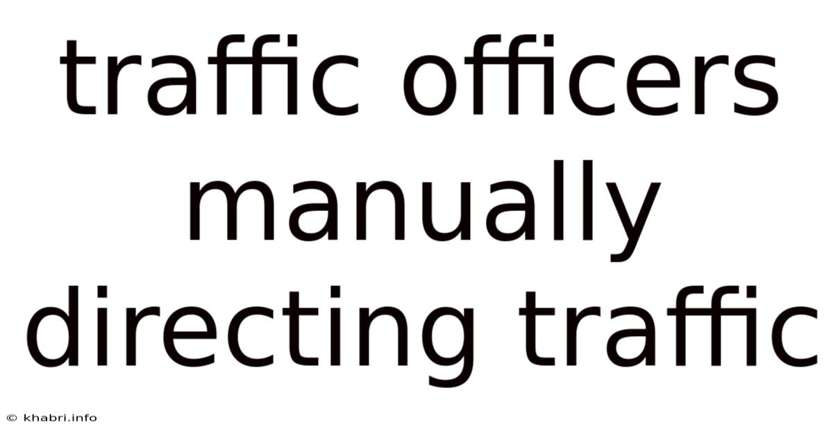 Traffic Officers Manually Directing Traffic